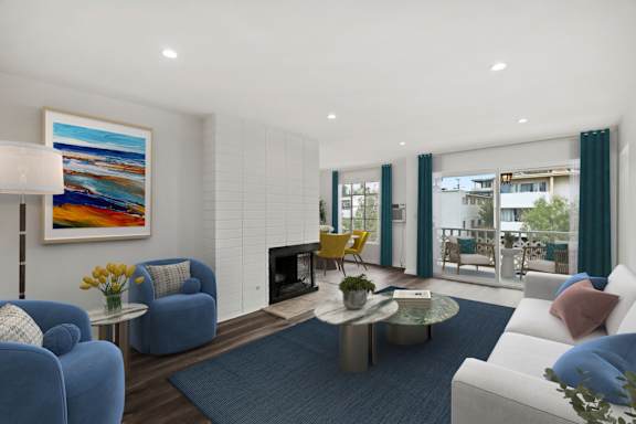 a living room with a blue couch and a table with yellow chairs