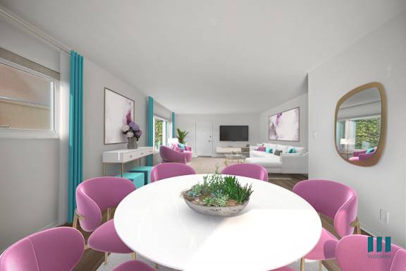 a living room with a blue couch and a table and chairs