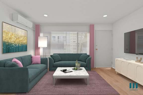 a living room with a couch and a table  and a bed