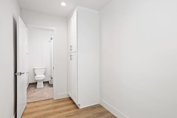 Studio Apartment Bedroom with Storage Cabinet and Full-Size Bathroom