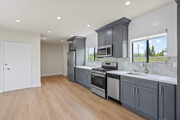 Open-Concept Kitchen, Dining, and Living Room Areas