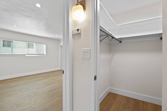 Walk-In Closet with Built-In Shelving