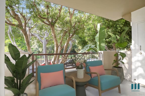 a living room with a couch and chairs and a table