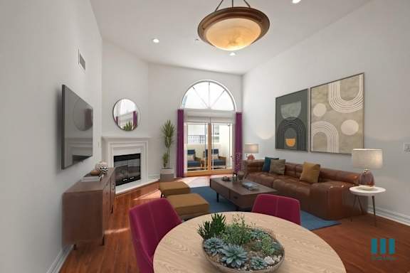 a dining area with yellow chairs and a round dining table