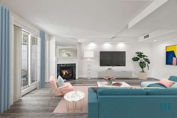 a white kitchen with stainless steel appliances and a blue rug