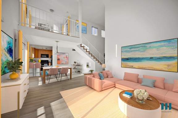 a living room with a couch and a table  and a bed