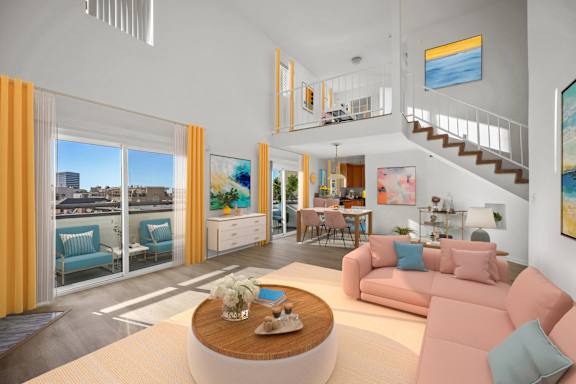 A living room with a pink couch and a wooden coffee table.