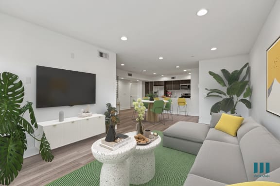 a living room with a couch and chairs and a table