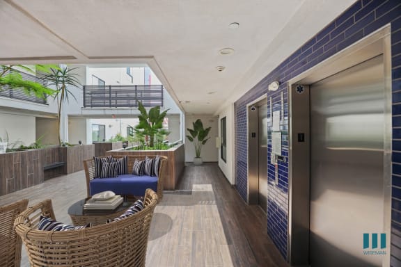 a kitchen with stainless steel appliances and white cabinets