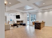 Thumbnail 8 of 33 - Living Area with TV at AVIA Apartments On Alpha, Dallas