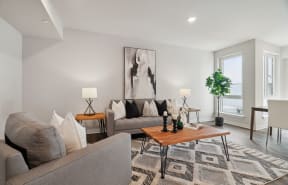 a living room with couches and a coffee table