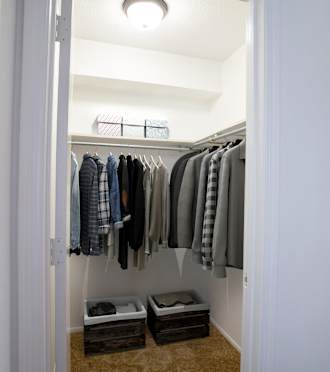 a walk in closet in a 555 waverly unit