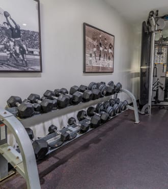 a gym with treadmills and other exercise equipment in a home