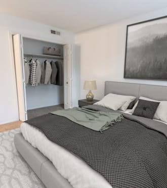 a bedroom with a bed and a lamp and a mirror