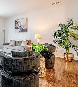 a living room with a couch and a round table
