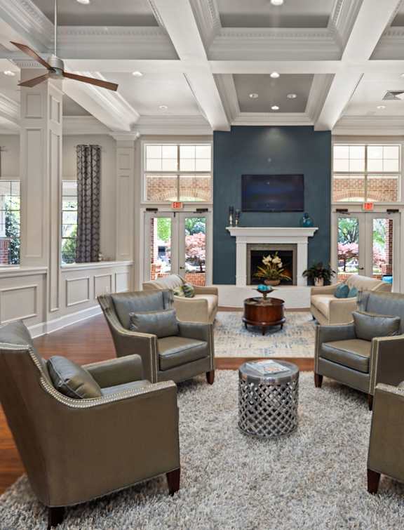 A living room with a fireplace and a television.