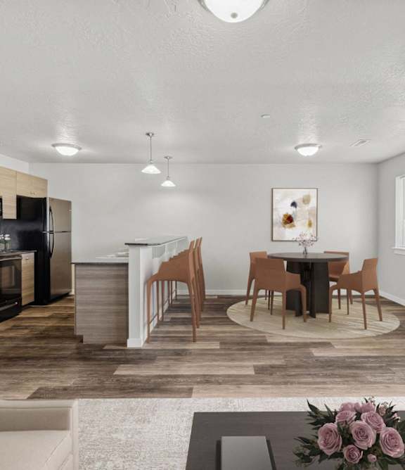 a living room and kitchen with a table and chairs