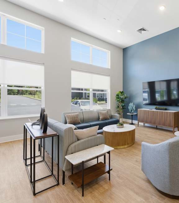 A modern kitchen with a dining table and chairs.