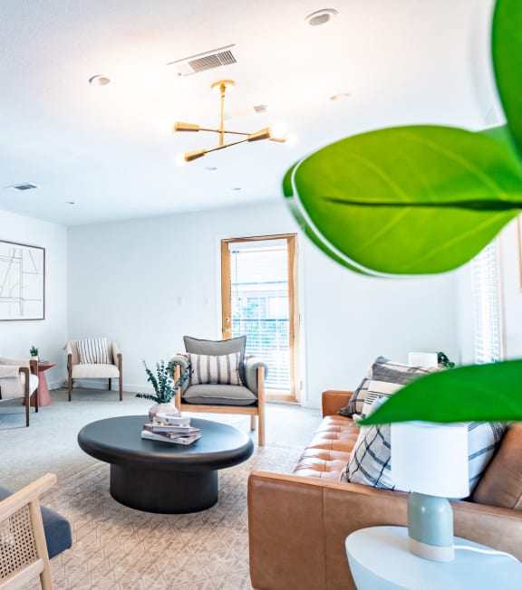 a living room with furniture and a dining table