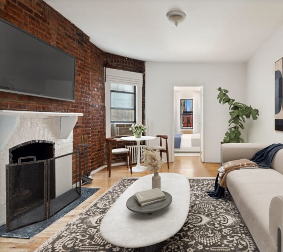 a living room with a white couch and a fireplace