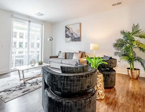 a living room with a couch and a round table