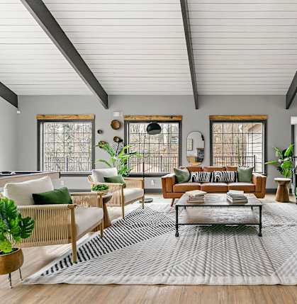 A living room with a green couch and a coffee table.