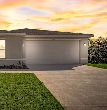 A modern house with a garage and a driveway.