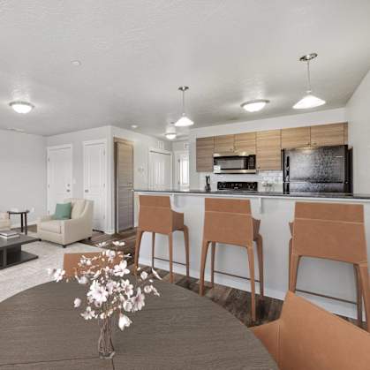 a living room and kitchen with a table and chairs