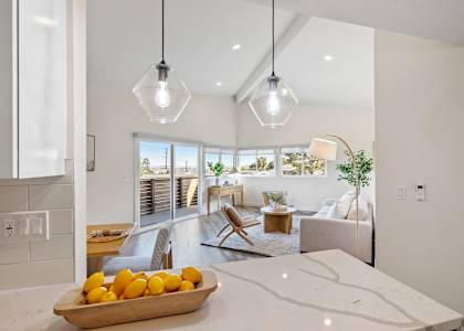 a living room with a table with oranges on it
