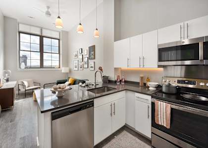 a kitchen with a large counter top and a sink