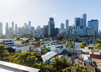 the city skyline with houses and skyscrapers