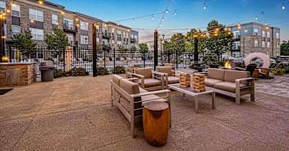 a terrace with chairs and lights at Penn Circle, Carmel, Indianapolis
