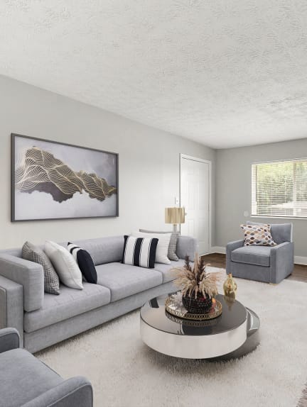 a living room with a bed and a kitchen with a table and chairs at Balfour East in Atlanta, 30316