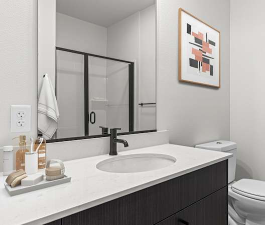 a bathroom with a sink and toilet in a 555 waverly unit at The Hemlock, Seattle, WA