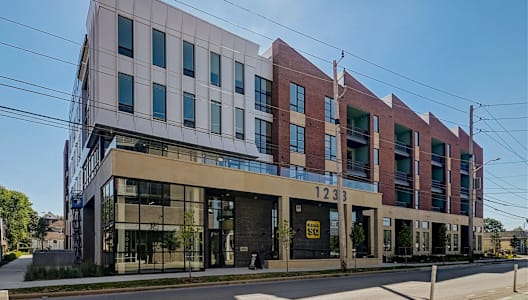 a building with a sign that reads 1213 on the side of it