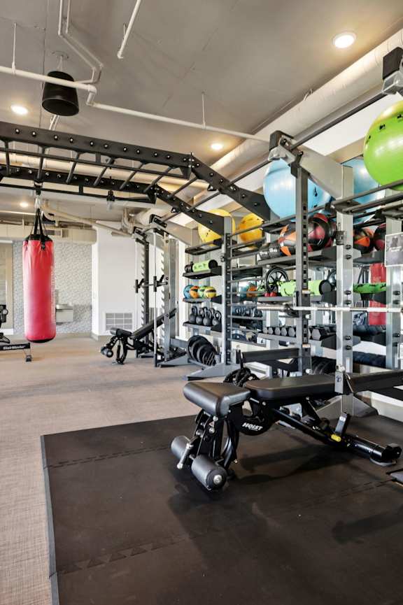 Woman standing in a gym at Aura Vegas Apartments, Las Vegas