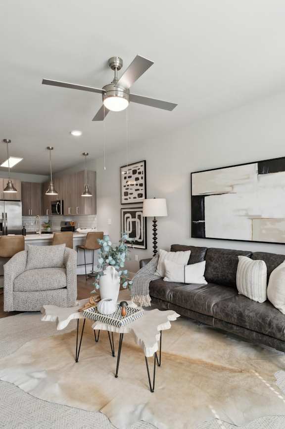 A modern kitchen with a dining table and chairs at The Hendry Apartments, Fort Myers, FL, 33905