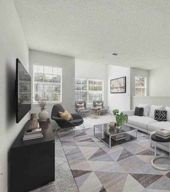 A living room with a couch, chair, and coffee table.