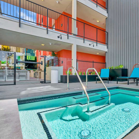 A pool with a slide in the middle of it.