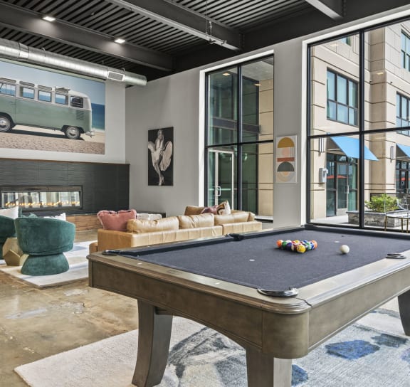 a pool table in the clubhouse at the bradley braddock road station apartments  at The Icon, Virginia