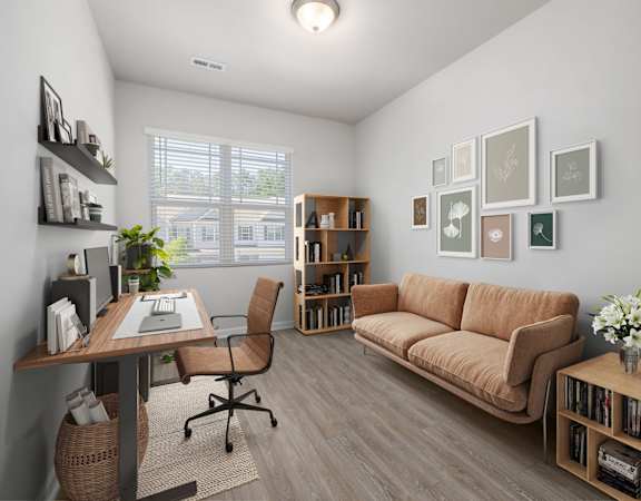 a living room with a couch and a desk