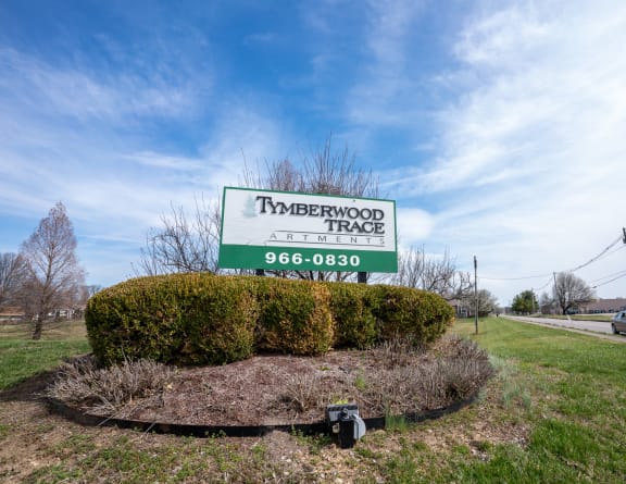 the sign at the entrance to bath farms with flowers