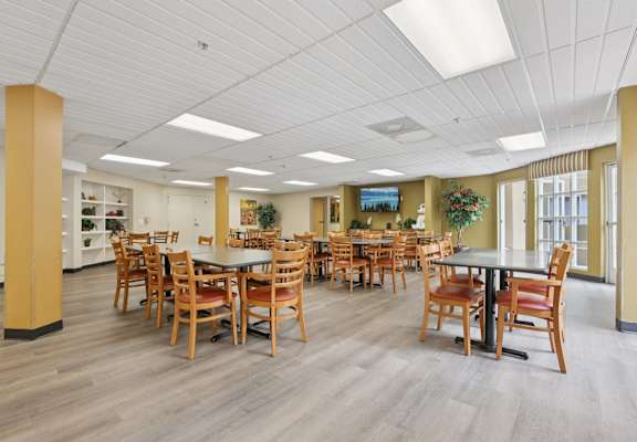 A large room with tables and chairs.