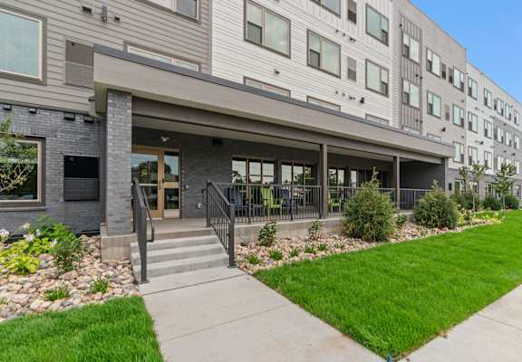 the residences at city center apartments exterior of building with stairs and grass
