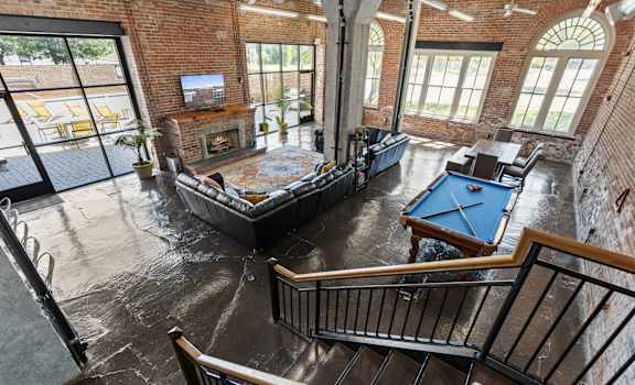 an aerial view of a living room with a pool table