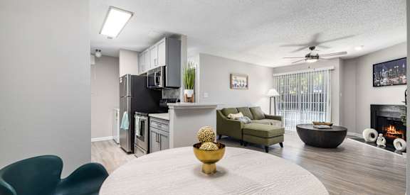 our apartments offer a living room with a dining table and a kitchen