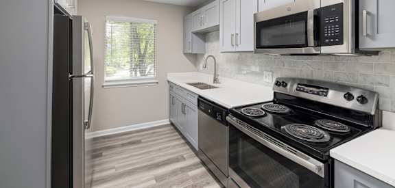 Modern Kitchen with cabinets at The Madison at Adams Farm, Greensboro, NC