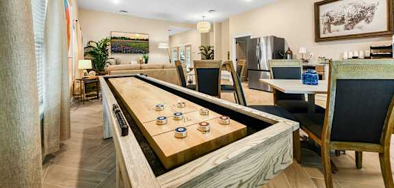 a dining room with a long table with cups on it