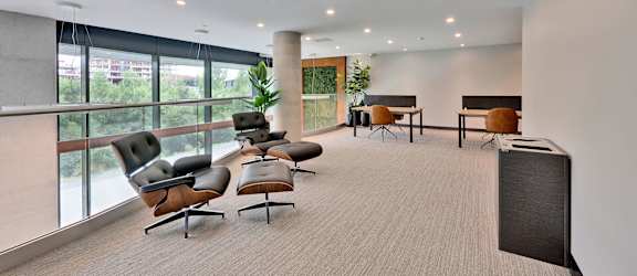 A conference room with a long table and chairs.