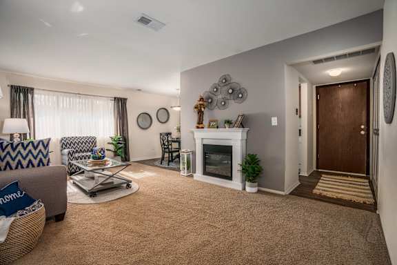 a living room with a fireplace and a couch